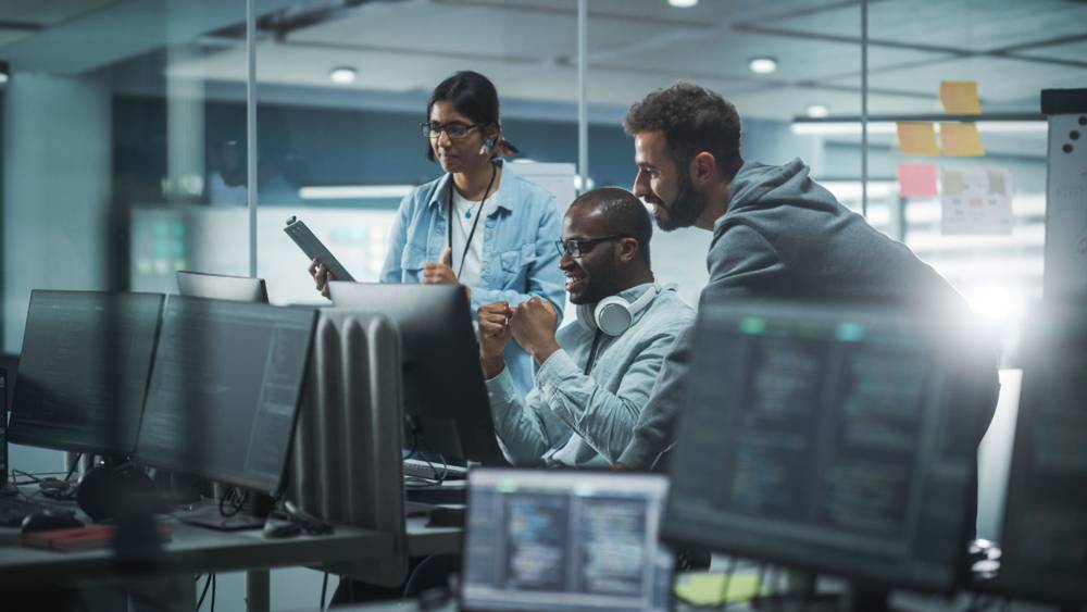 Team comparing software options in a meeting