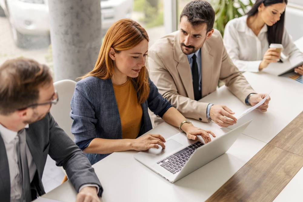 Team discussing a contract in a boardroom